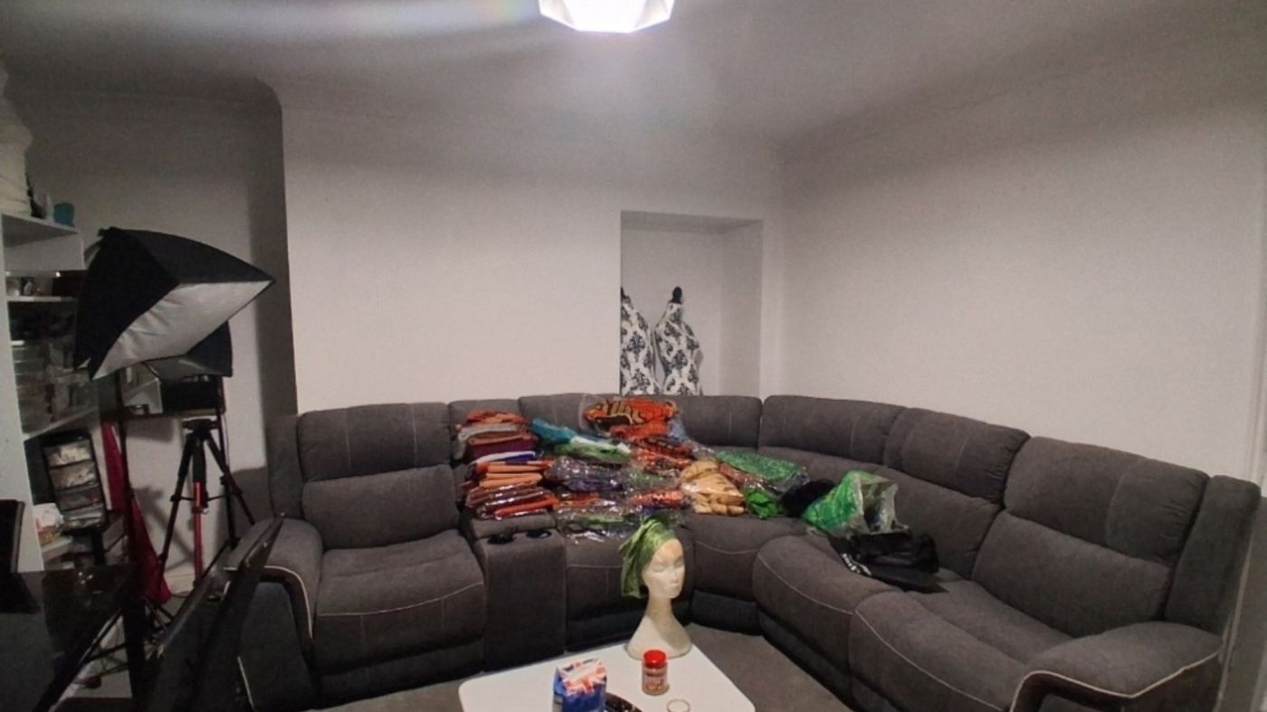 The living room before, cluttered and plain